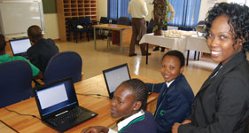 Francisca Chikondo, senior IT tutor of ADT Teach Johannesburg with some of the learners